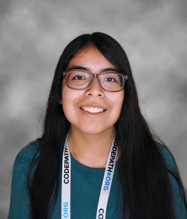 Arely is wearing a dark green shirt.